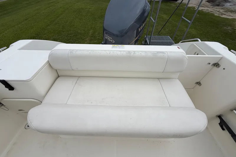 Slide: The Image of White seating area on a 2006 Pursuit 2570 Offshore boat with Yamaha engine. - 27