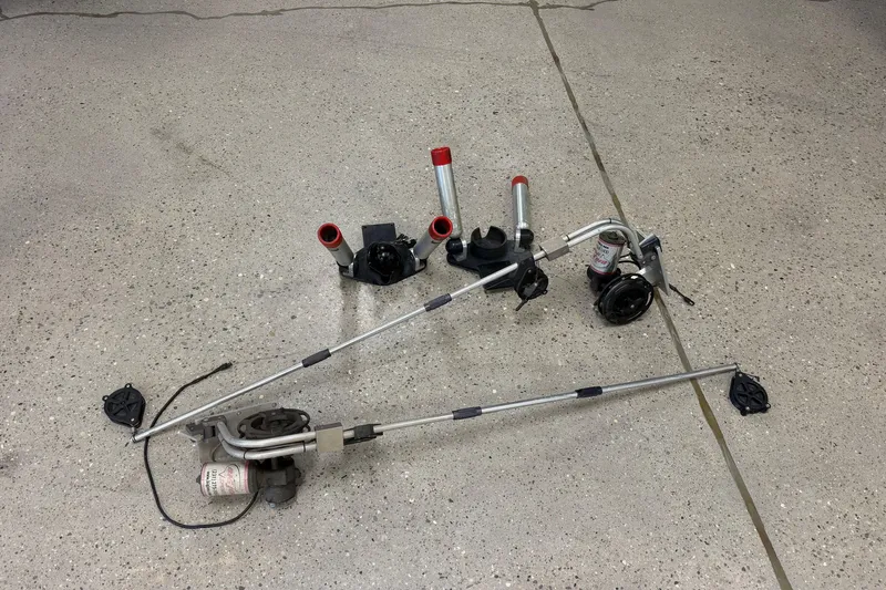Slide: The Image of Boat outriggers and mounts on concrete floor, compatible with 2006 Pursuit 2570 Offshore. - 37