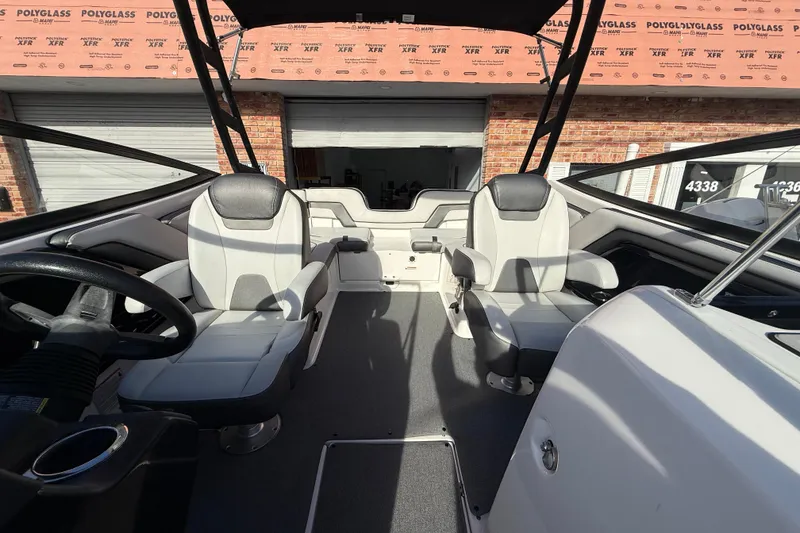 Slide: The Image of Interior of 2020 Yamaha Boats AR230, featuring sleek seating and modern design elements. - 12