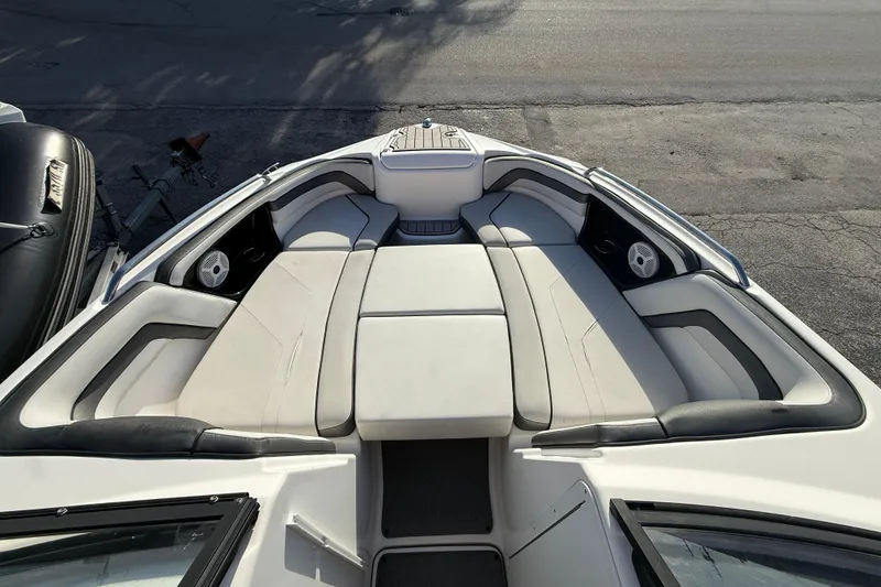 Slide: The Image of 2020 Yamaha Boats AR230 interior with spacious seating and sleek design. - 16