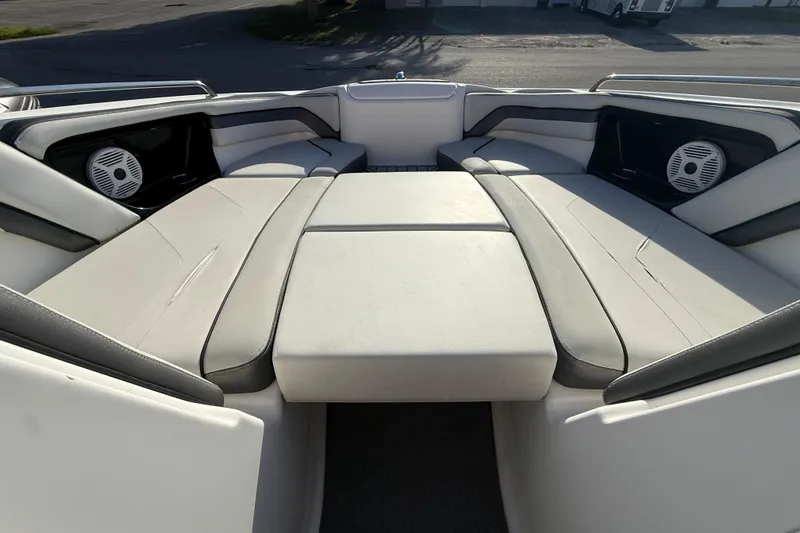 Slide: The Image of Interior view of 2020 Yamaha Boats AR230, featuring spacious seating and built-in speakers. - 17