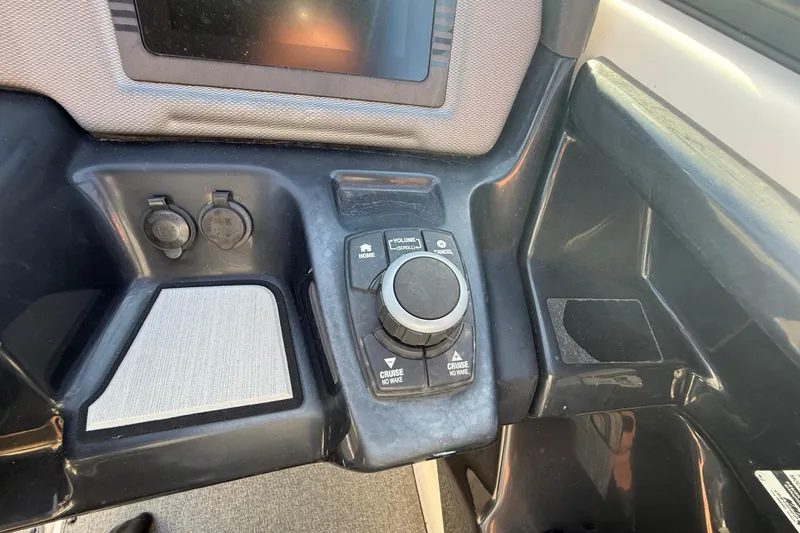 Slide: The Image of Control panel of a 2020 Yamaha Boats AR230 with navigation and cruise controls. - 20