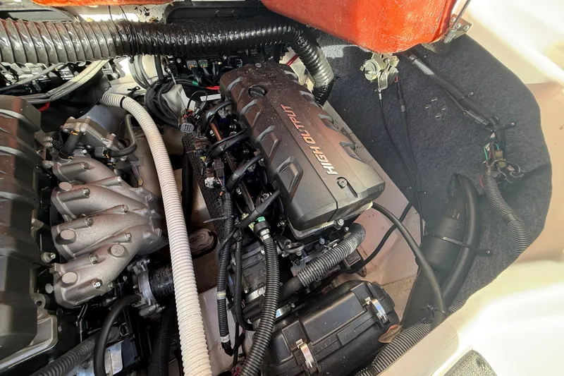 Slide: The Image of Engine compartment of a 2020 Yamaha Boats AR230, showcasing high output components. - 24