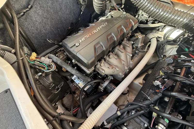 Slide: The Image of Engine compartment of a 2020 Yamaha Boats AR230, showcasing high output engine components. - 25