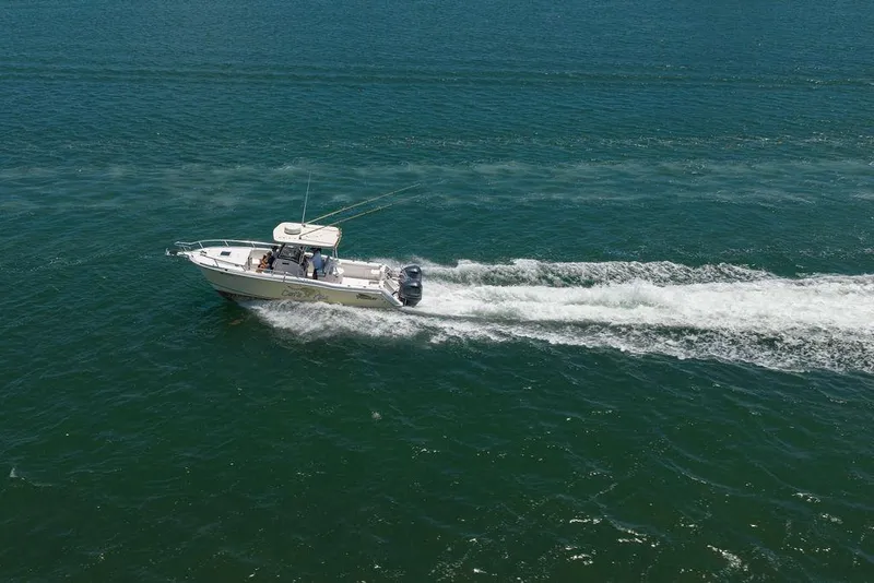 The Image of 2007 ProKat 2860 Center Console boat cruising on open water. - 0