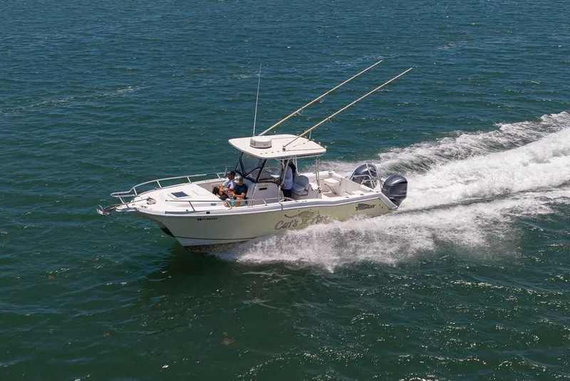 Slide: The Image of 2007 ProKat 2860 Center Console boat cruising on open water, showcasing speed and performance. - 10
