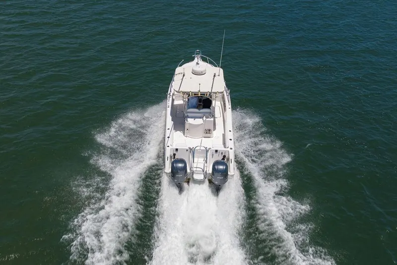Slide: The Image of 2007 ProKat 2860 Center Console boat cruising on open water. - 13