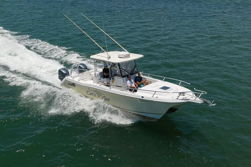 Slide: The Image of 2007 ProKat 2860 Center Console boat cruising on open water. - 18