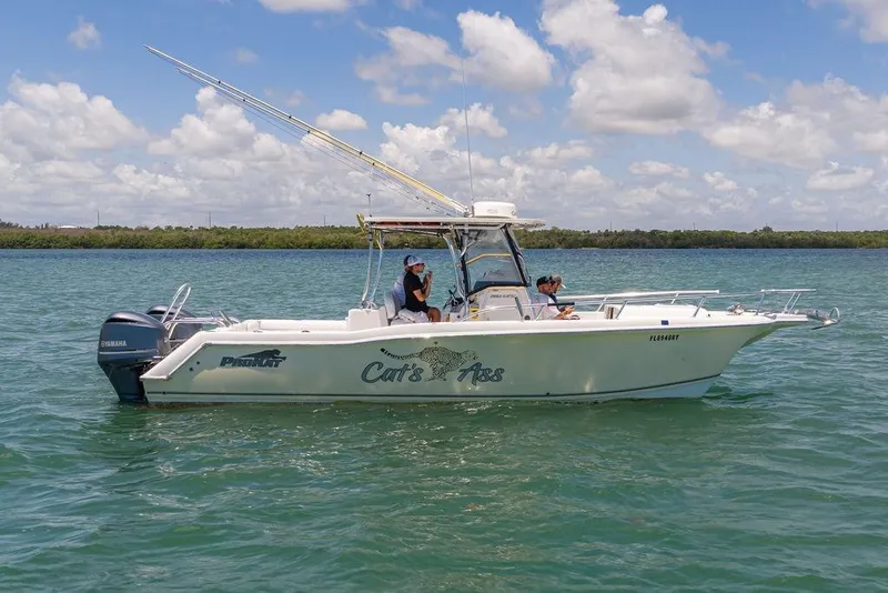 Slide: The Image of 2007 ProKat 2860 Center Console boat on water, featuring dual Yamaha engines. - 19