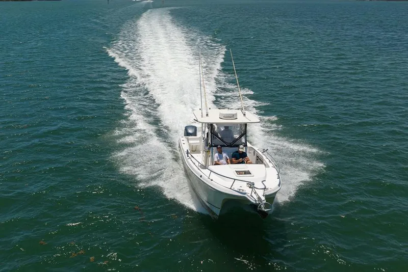 Slide: The Image of 2007 ProKat 2860 Center Console boat cruising on open water. - 21