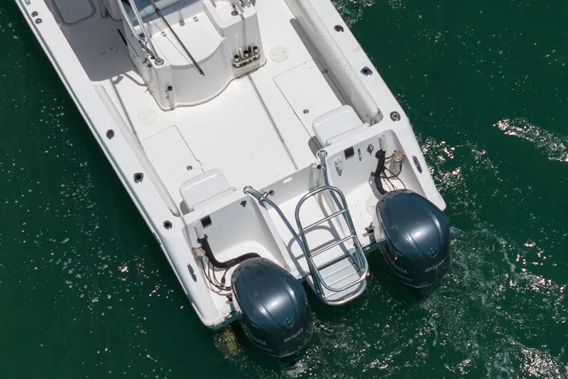 Slide: The Image of 2007 ProKat 2860 Center Console boat with dual outboard motors on water. - 22