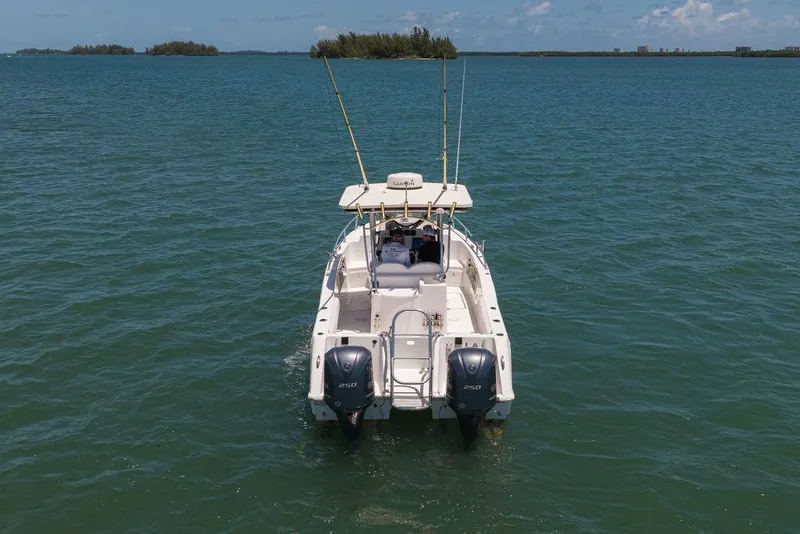 Slide: The Image of 2007 ProKat 2860 Center Console boat on open water, rear view. - 24