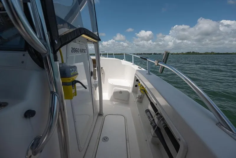 Slide: The Image of 2007 ProKat 2860 Center Console boat on open water under a partly cloudy sky. - 31