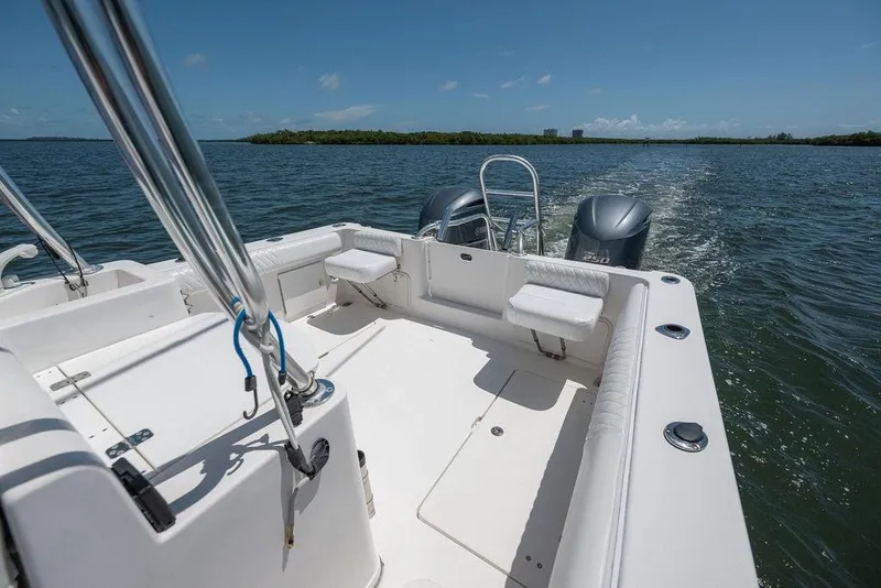 Slide: The Image of 2007 ProKat 2860 Center Console boat cruising on open water, clear sky. - 35