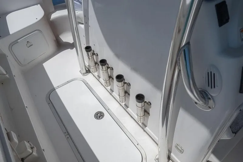 Slide: The Image of 2007 ProKat 2860 Center Console boat interior with rod holders and storage compartments. - 36