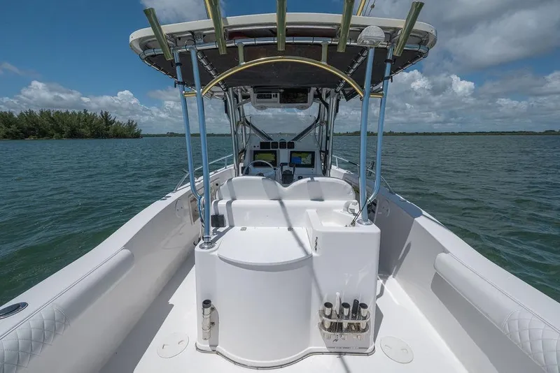 Slide: The Image of 2007 ProKat 2860 Center Console boat on open water, featuring spacious deck and fishing equipment. - 38