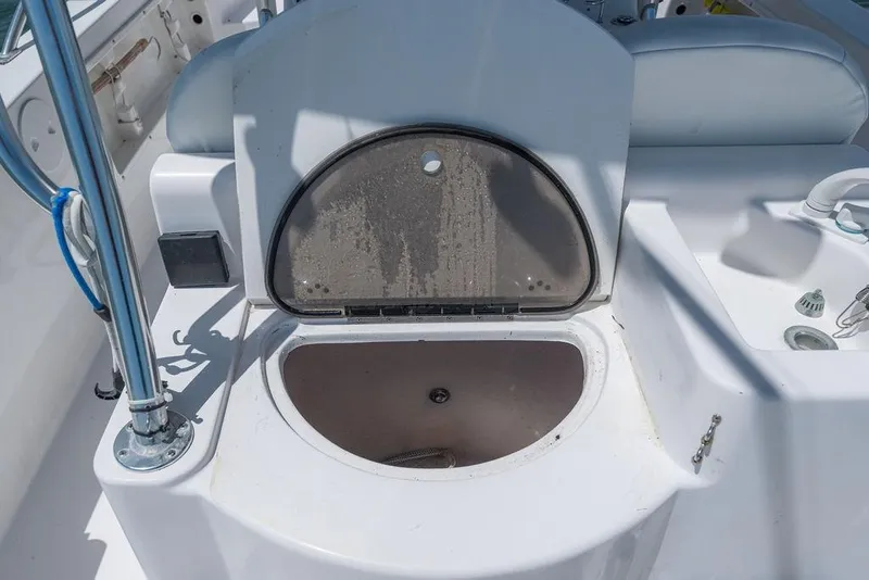 Slide: The Image of 2007 ProKat 2860 Center Console boat with open storage compartment on deck. - 40