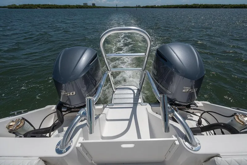 Slide: The Image of 2007 ProKat 2860 Center Console boat with dual Yamaha 250 engines on open water. - 42