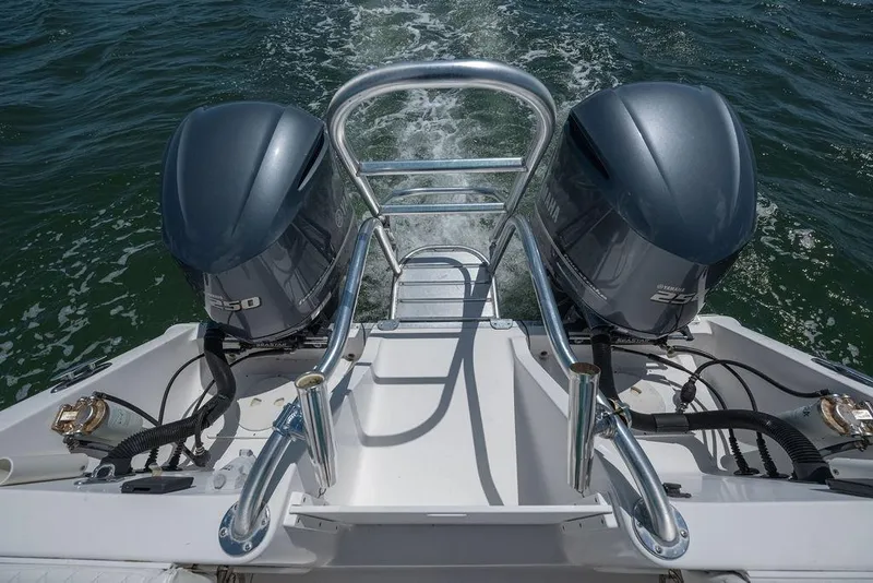 Slide: The Image of 2007 ProKat 2860 Center Console boat with dual Yamaha engines on open water. - 44