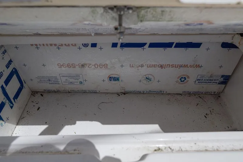 Slide: The Image of Storage compartment of a 2007 ProKat 2860 Center Console boat, showing insulation details. - 52
