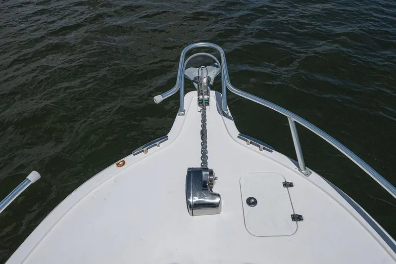 Slide: The Image of Bow of 2007 ProKat 2860 Center Console with anchor chain over water. - 55