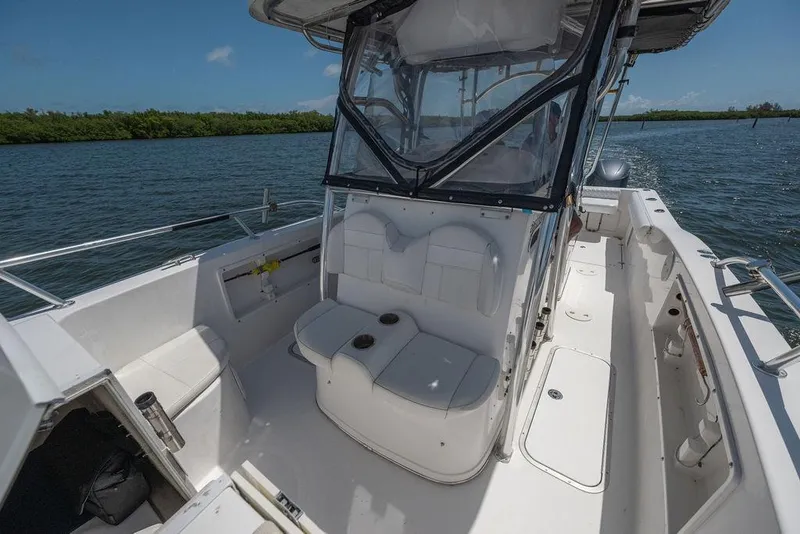 Slide: The Image of 2007 ProKat 2860 Center Console boat interior with seating, on calm water. - 57