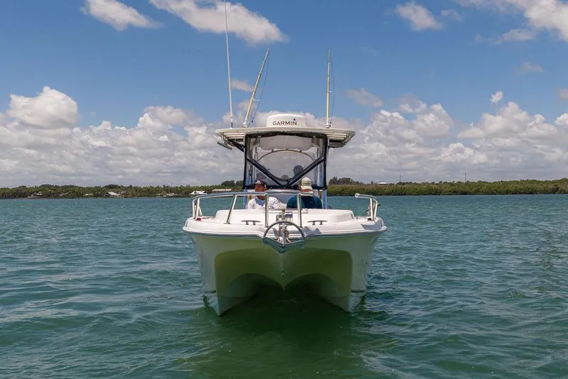 Slide: The Image of 2007 ProKat 2860 Center Console boat on calm water under a partly cloudy sky. - 8
