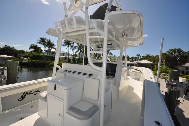 Slide: The Image of 2011 Yellowfin 39 Offshore boat docked, featuring sleek design and spacious deck. - 10