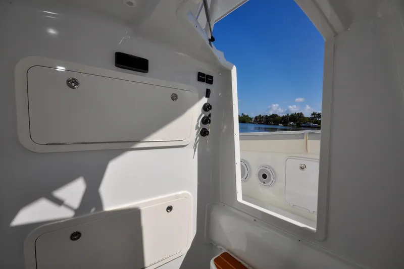 Slide: The Image of Interior view of 2011 Yellowfin 39 Offshore boat with storage compartments and water view. - 14