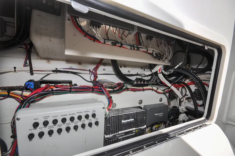 Slide: The Image of Electrical panel and wiring inside a 2011 Yellowfin 39 Offshore boat. - 16