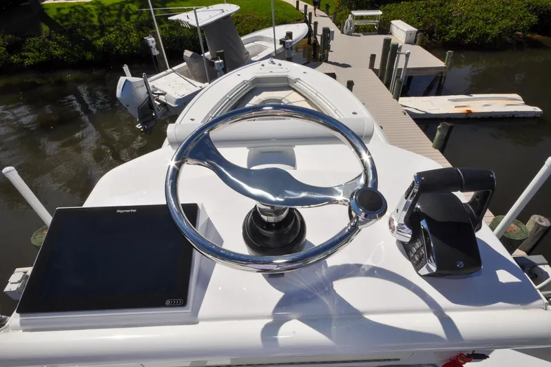 Slide: The Image of Steering console of 2011 Yellowfin 39 Offshore boat with Raymarine display and throttle controls. - 20