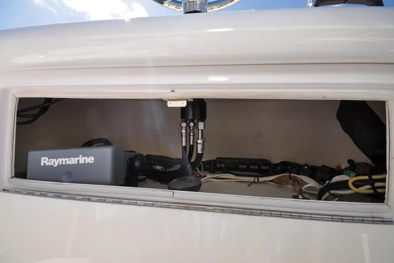 Slide: The Image of 2011 Yellowfin 39 Offshore boat electronics compartment with Raymarine equipment. - 21