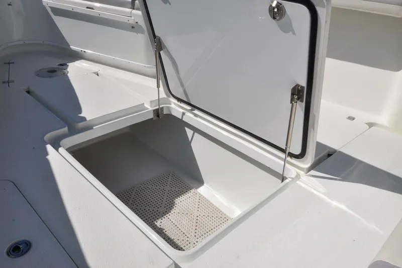 Slide: The Image of Open storage compartment on 2011 Yellowfin 39 Offshore boat deck. - 30
