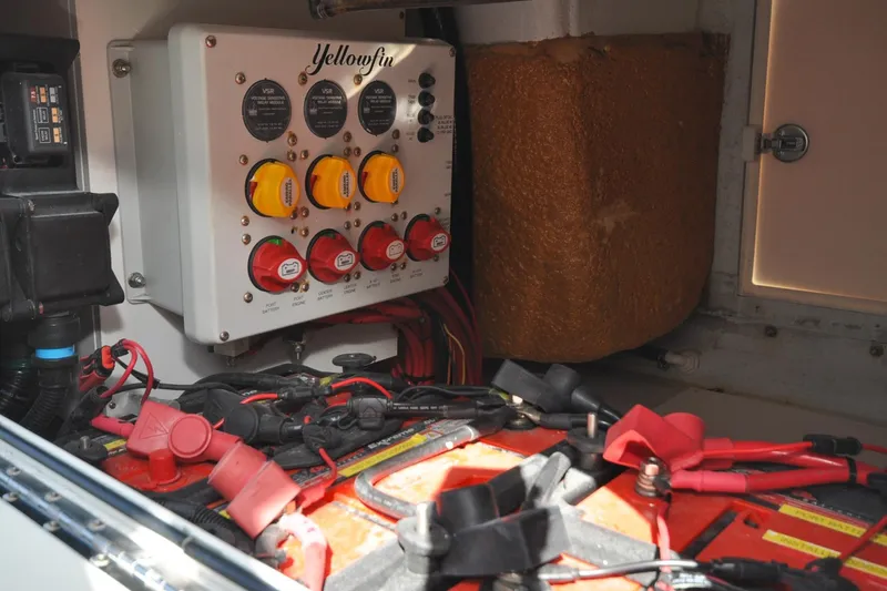 Slide: The Image of Electrical panel and battery setup in a 2011 Yellowfin 39 Offshore boat. - 38