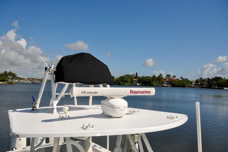 Slide: The Image of 2011 Yellowfin 39 Offshore boat with Raymarine radar on calm water under blue sky. - 42