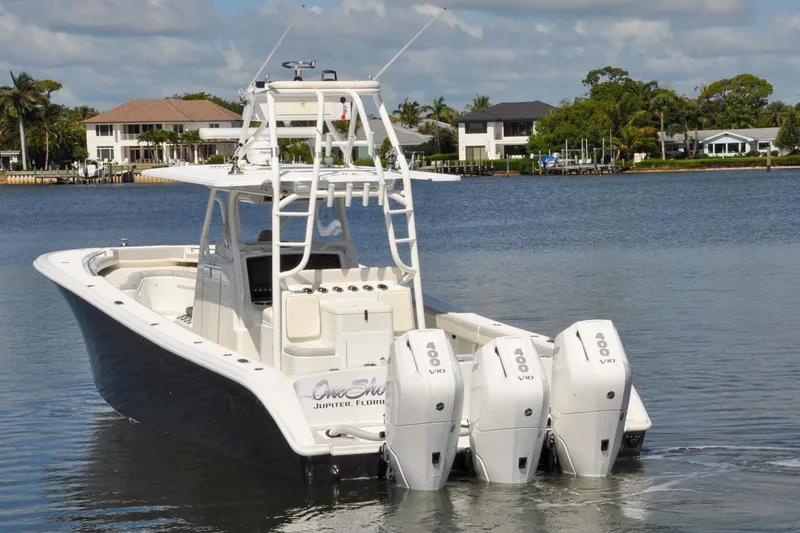 Slide: The Image of 2011 Yellowfin 39 Offshore boat with triple 400 V10 engines on a calm waterway. - 44