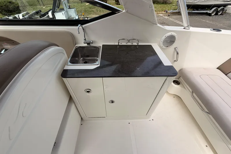 Slide: The Image of 2011 Sea Ray 300 SLX boat interior with sink and countertop. - 11