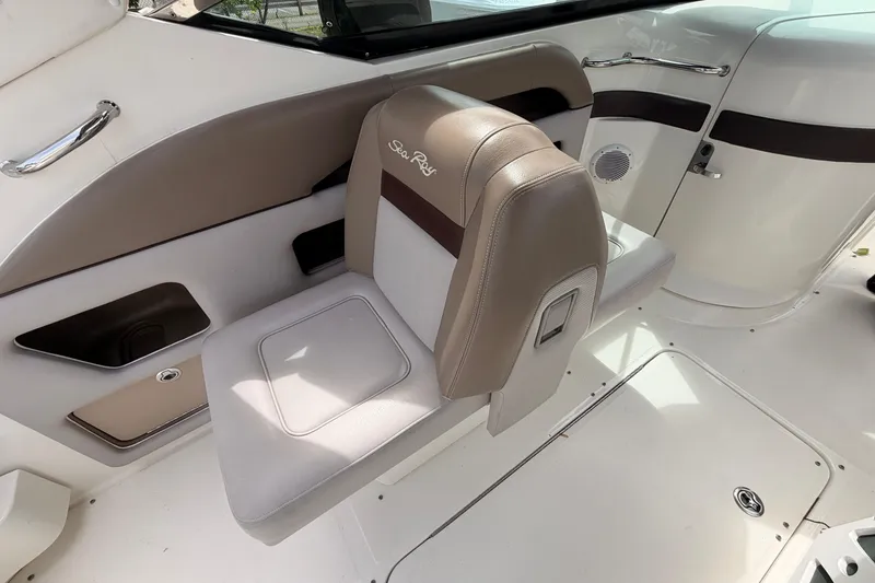 Slide: The Image of Interior seating of 2011 Sea Ray 300 SLX boat, featuring beige and white upholstery. - 16