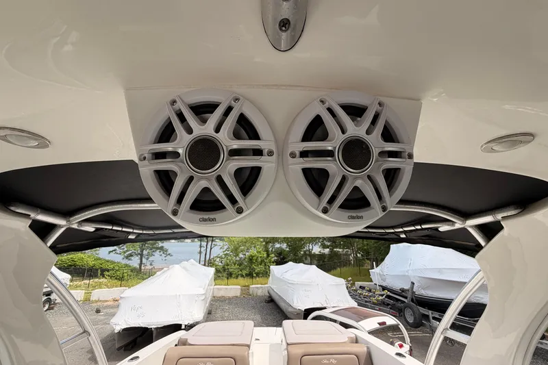 Slide: The Image of Speakers on a 2011 Sea Ray 300 SLX boat, with covered boats in the background. - 19