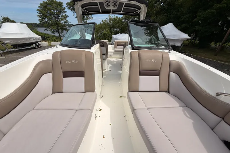 Slide: The Image of 2011 Sea Ray 300 SLX boat interior with beige seating and open deck. - 22