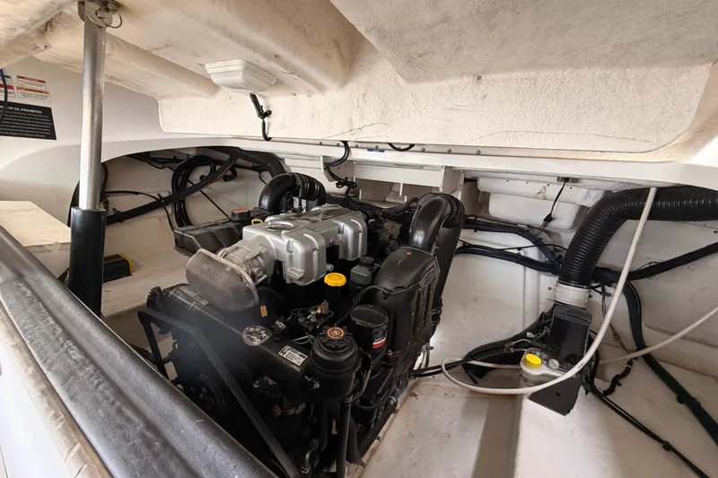 Slide: The Image of Engine compartment of a 2011 Sea Ray 300 SLX boat, showcasing mechanical components. - 23