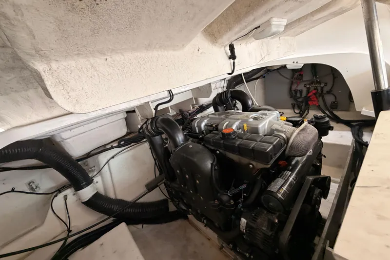 Slide: The Image of Engine compartment of a 2011 Sea Ray 300 SLX boat, showcasing mechanical components. - 24