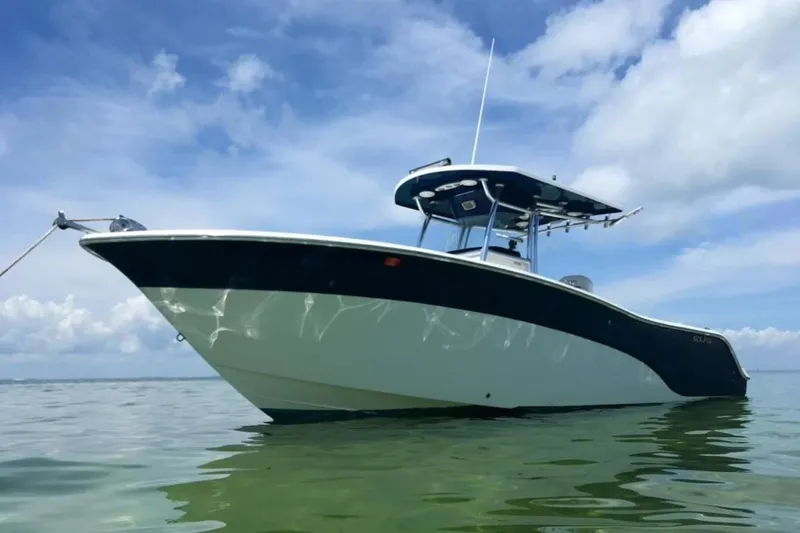 The Image of 2009 Sea Fox 288 Commander boat on calm water under a blue sky. - 1