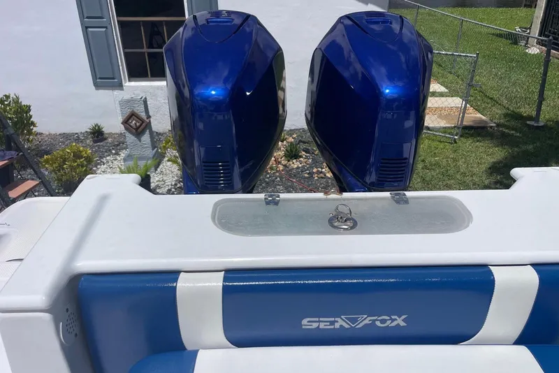 Slide: The Image of Blue Sea Fox 288 Commander boat engines, 2009 model, in a backyard setting. - 13