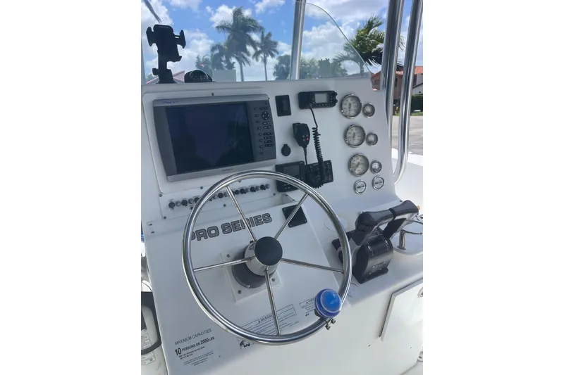 Slide: The Image of 2009 Sea Fox 288 Commander boat dashboard with steering wheel and navigation instruments. - 17