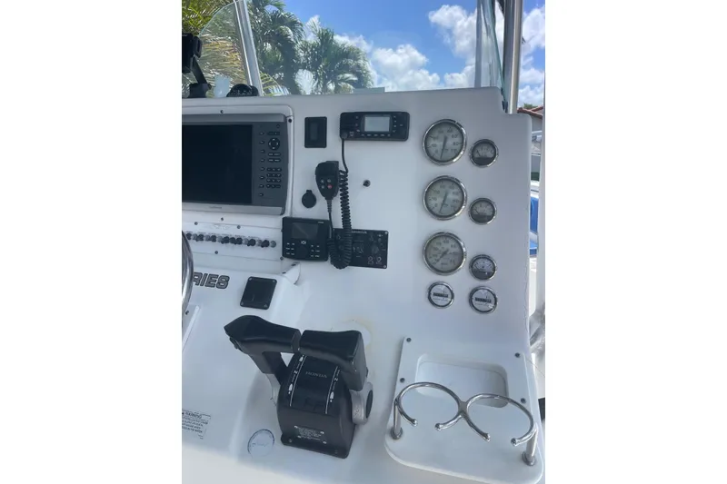 Slide: The Image of Console of a 2009 Sea Fox 288 Commander boat with gauges and controls. - 18