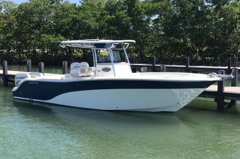 Slide: The Image of 2009 Sea Fox 288 Commander boat docked on calm water. - 2