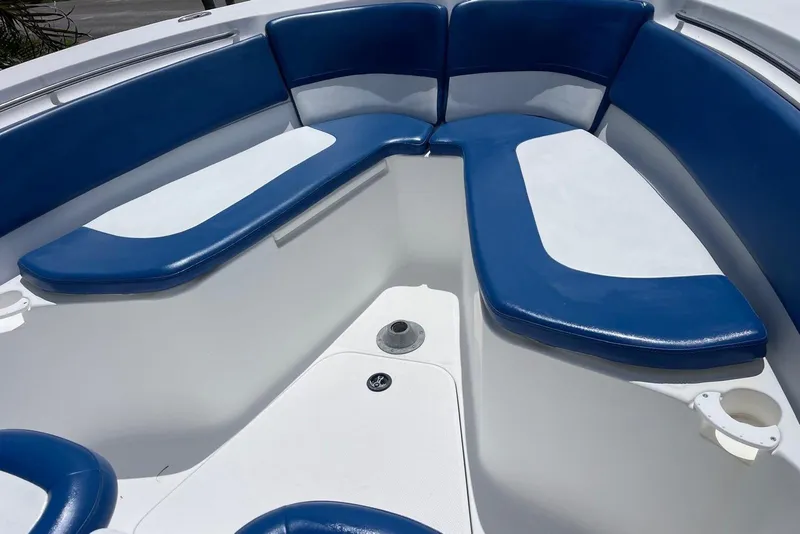 Slide: The Image of Interior seating of 2009 Sea Fox 288 Commander boat with blue and white cushions. - 6