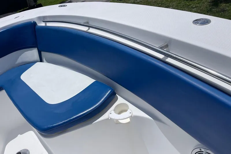 Slide: The Image of Interior view of a 2009 Sea Fox 288 Commander boat with blue and white seating. - 7