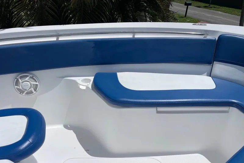 Slide: The Image of Interior seating of a 2009 Sea Fox 288 Commander boat with blue and white cushions. - 9